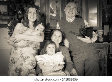 Imitation Of Vintage Photo Of Christmas Portrait Of Happy Family Of Photographer