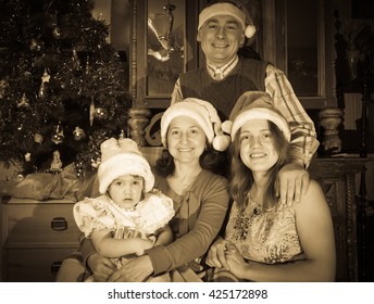 Imitation Of  Vintage Photo Of Happy  Family Of Three Generations Posing For  Christmas Portrait At Home