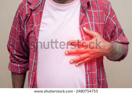 Imitative presentation of old age heart pain. An old man feeling chest discomfort or heart attack. 