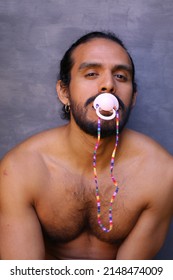 Immature man using a pacifier