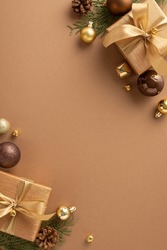 Immerse Yourself In Holiday Spirit With Air Of Sophistication. Vertical Top View Of Gift Boxes, Brown And Gold Ornaments And More On Lavish Brown Surface, Leaving Space For Holiday Wishes Or Promotion