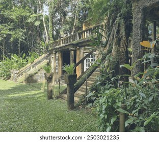 Immerse yourself in the mystical beauty of Paronella Park, Cairns. This enchanting rainforest scene captures lush greenery and serene waterfalls, perfect for travel brochures, nature-inspired projects - Powered by Shutterstock