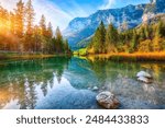 Immerse yourself in the tranquil beauty of Hintersee Lake in Bavaria, Germany, with this captivating photograph. Surrounded by the majestic Alps and dense forests, Hintersee Lake offers a serene.
