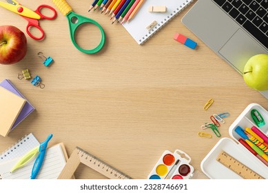 Immerse yourself in world of online education with this captivating top-view image showcasing laptop, pencil case, notepads, snacks and stationery on wooden backdrop. Perfect for text or advertising - Powered by Shutterstock