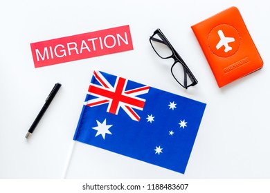 Immigration To Australia Concept. Text Immigration Near Passport Cover And Australian Flag On White Background Top View