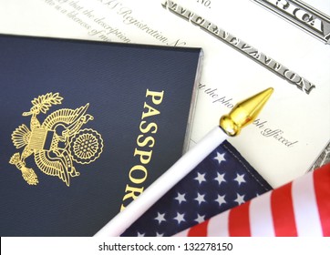 Immigration Concept, US Passport And Flag Over A Citizenship And Naturalization Certificate
