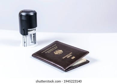 Immigration And Passport Control At The Airport. Border Control. Stamp In The German Passport Of Citizen. Concept