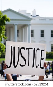 An Immigration Reform Activist Holds A Sign Reading 