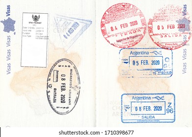 Immigration stamps of Indonesia, Uruguay, Paraguay and Argentina in a French passport. No personal data