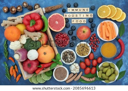 Immune boosting food for a healthy vegan diet with vegetables, fruit, medicinal herbs and spice. Foods very high in antioxidants, anthocayanins, fibre, lycopene, smart carbs, vitamins, minerals. 
