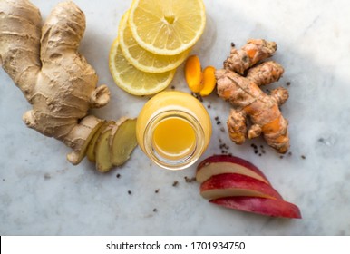 Immune System boosting Ginger, Turmeric, Lemon and Apple Shot in a glas bottle