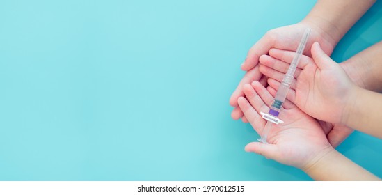 Immunization for Children baby kid.Mother and child hands holding syringe vaccine covid19 coronavirus.Medical health.immunity clinic.Healthcare injection vaccination.family vaccination, ipd, hepatitis