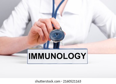 Immunology Concept. Immunologist With Stethoscope In Hand Treating Patient. Doctor In Lab Coat Diagnosing Allergies, Asthma And Immunologic Problems. Health Care Concept. High Quality Photo