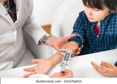 Immunology Doctor Measuring Allergy Reaction Of Patient, Little Boy