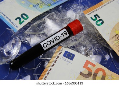 Impact Of Corona Virus Crisis On Global Economy, Immediate Financial Government Support Concept: Euro Money Paper Bank Notes On Pile Of Broken Glass Shards, Covid-19 Blood Vial, Blue Background 