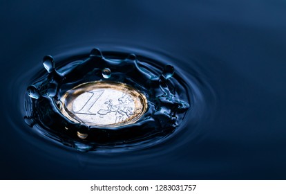 impact of a water drop splash on a euro coin in water