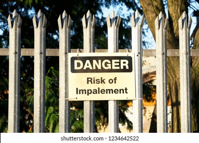 Impalement Danger And Risk Sign On Fence For Security And Protection