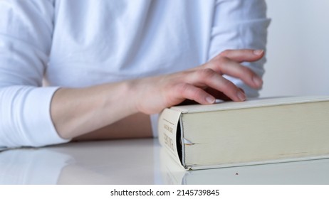 Impatient Nervous Woman Tapping Fingers On Book