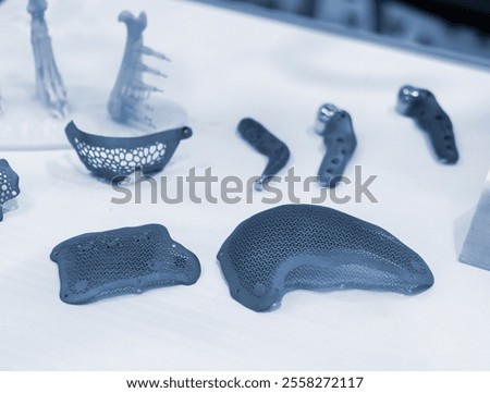 Implants and prostheses printed on 3D printer from biocompatible titanium powder. Cranioplasty for human skull, jaw fixation plates, plates for correction of deformity for animals. Endoprostheses