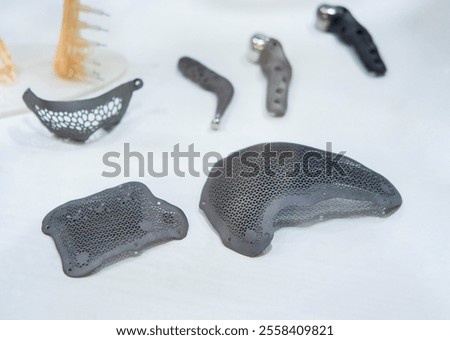 Implants and prostheses printed on 3D printer from biocompatible titanium powder. Cranioplasty for human skull, jaw fixation plates. . Endoprostheses. Bioengineering