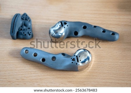 Implants and prostheses printed on 3D printer from biocompatible titanium powder. Jaw fixation plates for human skull. Endoprostheses. Bioengineering
