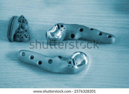 Implants and prostheses printed on 3D printer from biocompatible titanium powder. Jaw fixation plates for human skull. Endoprostheses. Bioengineering