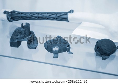 Implants and prostheses printed on 3D printer from biocompatible titanium powder. Individualized human implants hip joints and implants for replacing tubular bones. Endoprostheses. Bioengineering