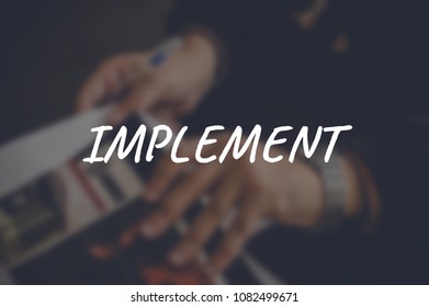 Implement word with blurring business background