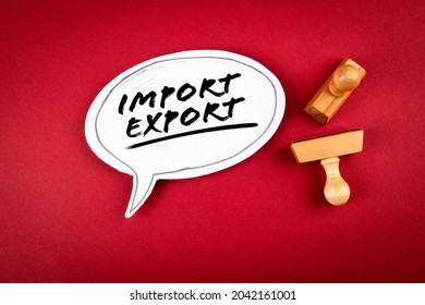 Import and Export concept. Speech bubble and wooden stamps on a red background.