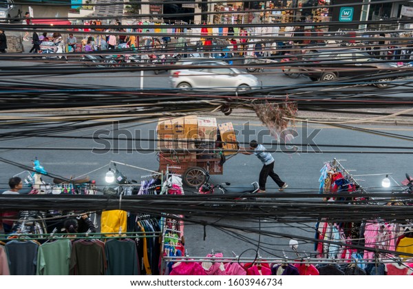 Import and Export goods on the way to the\
Thai-Myanmar Border in front of the Thai Border in the town of Mae\
Sai on the Border to Myanmar  in North Thailand.   Thailand, Mae\
Sai, November, 2019