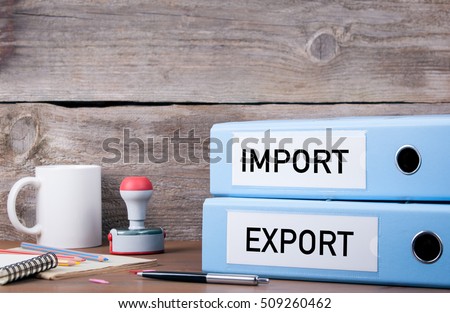 Import and Export. Two binders on desk in the office. Business background