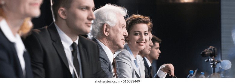 Important businesspeople answering the questions during business press conference - Shutterstock ID 516083449