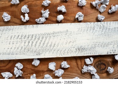Important Informations Written On Piece Of Wood With Paper Wraps Around On Floor  Crutial Announcements On Wooden Panel With Crumpled Notes All Over 