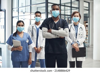 Its Important To Keep Yourself Protected. Shot Of A Group Of Doctors And Nurses Wearing Face Masks To Protect From Illness.