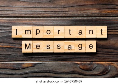 Important message word written on wood block. Important message text on wooden table for your desing, Top view concept.