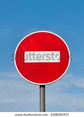 It is important for road users to know all road signs and follow the rules of the road. "No entry" road sign. Sign on the background of the sky.