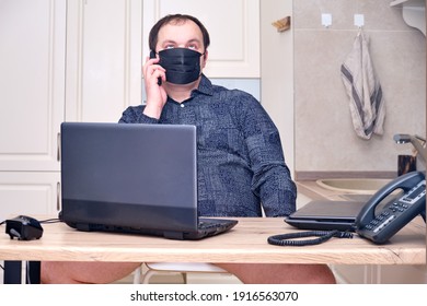 Important Serious Man In Face Mask Talking On The Phone From Home Office, Humor. Problems With Remote Work From Home During Lockdown