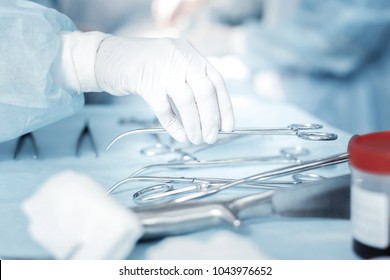Important things. Clean useful surgical instruments being on the table and taking by a nurse.
