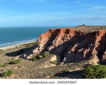 The imposing cliff at Punta do Mel in Brazil. Colorful ocean front mountain