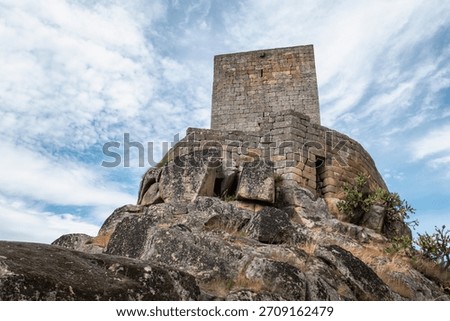 Imposing keep of Marialva Castle, erected on a natural rocky promontory, against a dramatic sky in the historic citadel of Mêda in Portugal