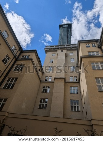 Imposing Ostrava New Town Hall tower dynamic low-angle composition under vibrant blue sky