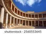 The imposing remains of the historic Charles V renaissance palace with the a round central courtyard within a rectangular structure, the Alhambra, Granada, Andalusia, Spain