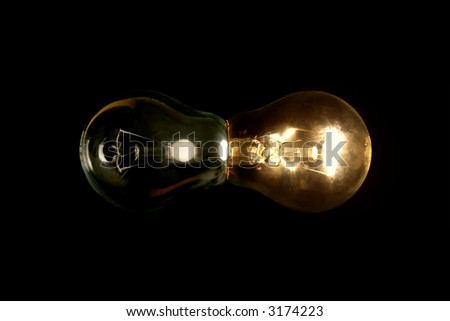 Impossible combination of two lamps on black background