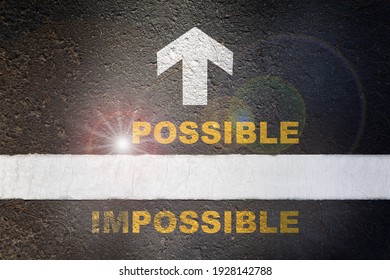 Impossible Word Without Im With Arrow On Black Asphalt Road Surface. Possible Business Challenge Concept And Overcome Success Idea