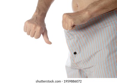 Impotence Concept. Man Is Looking Inside Underwear and Is Showing Thumb Down