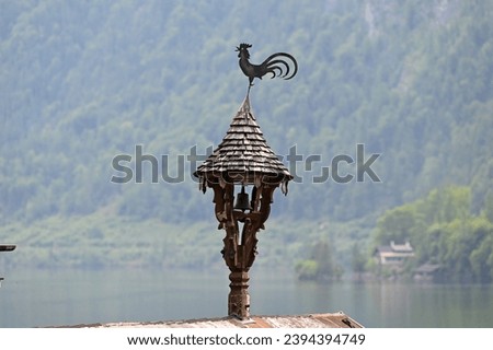 An impression of the famous town of Hallstatt on Lake Hallstatt - in the picture a weathercock
