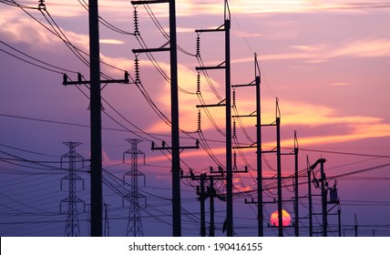 Impression network at transformer station in sunrise, high voltage up to full color sky take with sunset  tone, horizontal frame 