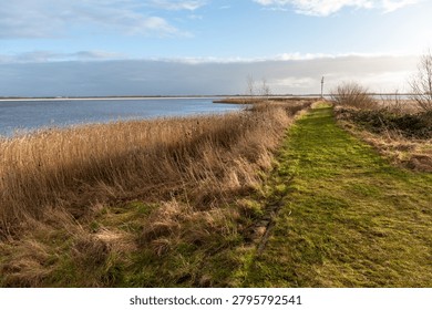 Impression of a sunset on a relatively cold frosty winter evening in the dutch province of Friesland. The image is from near the town of lemmer and the classic steam-driven water pump woudagemaal.