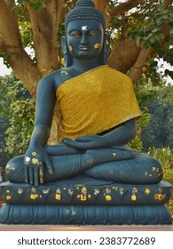 impressive Buddha statue at historical place of siddartha gautama in sarnath, india