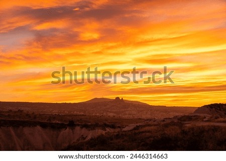 impressive cloudy sunset at the deep of the Red Valley Cappadocia